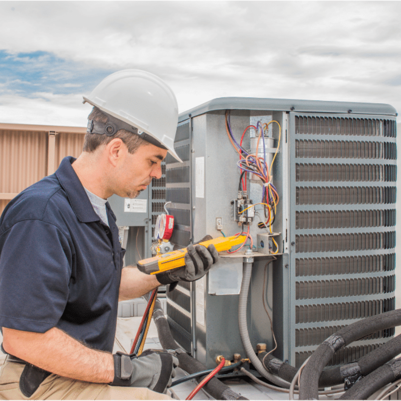 Ancaster Heating & Cooling HVAC technician servicing a system