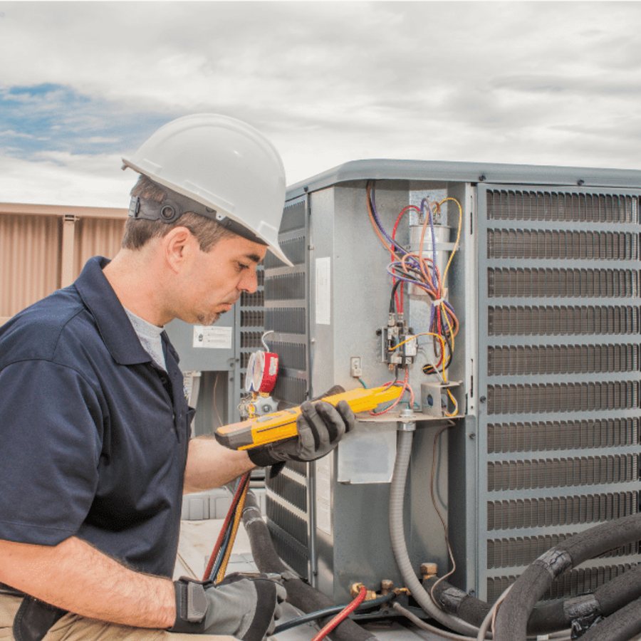 Ancaster Heating & Cooling HVAC technician servicing a system